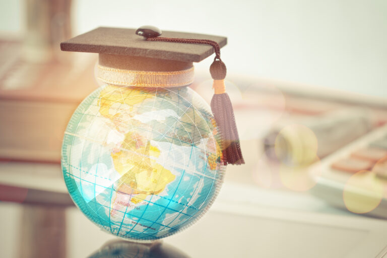 Graduated,Study,Abroad,International,Conceptual,,Graduation,Hat,On,Top,Earth